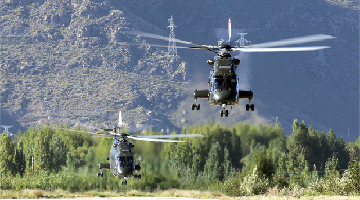 Helicopters conduct tactical flight training