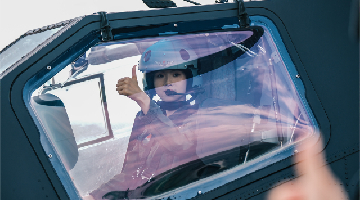 Female pilot gets ready for flight training exercise