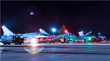 Pilots go through pre-flight procedures before closing canopy