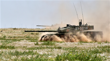 Main battle tank passes through shallow trench