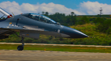 Fighter jet taxis on runway during flight training