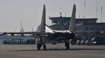 Fighter jets leave aircraft hangars before takeoff