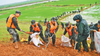 PLA, PAP, militias fight on frontline of flood control, disaster relief