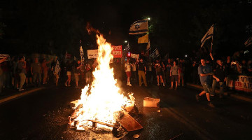 People attend protest calling for immediate ceasefire between Israel and Hamas in Gaza Strip